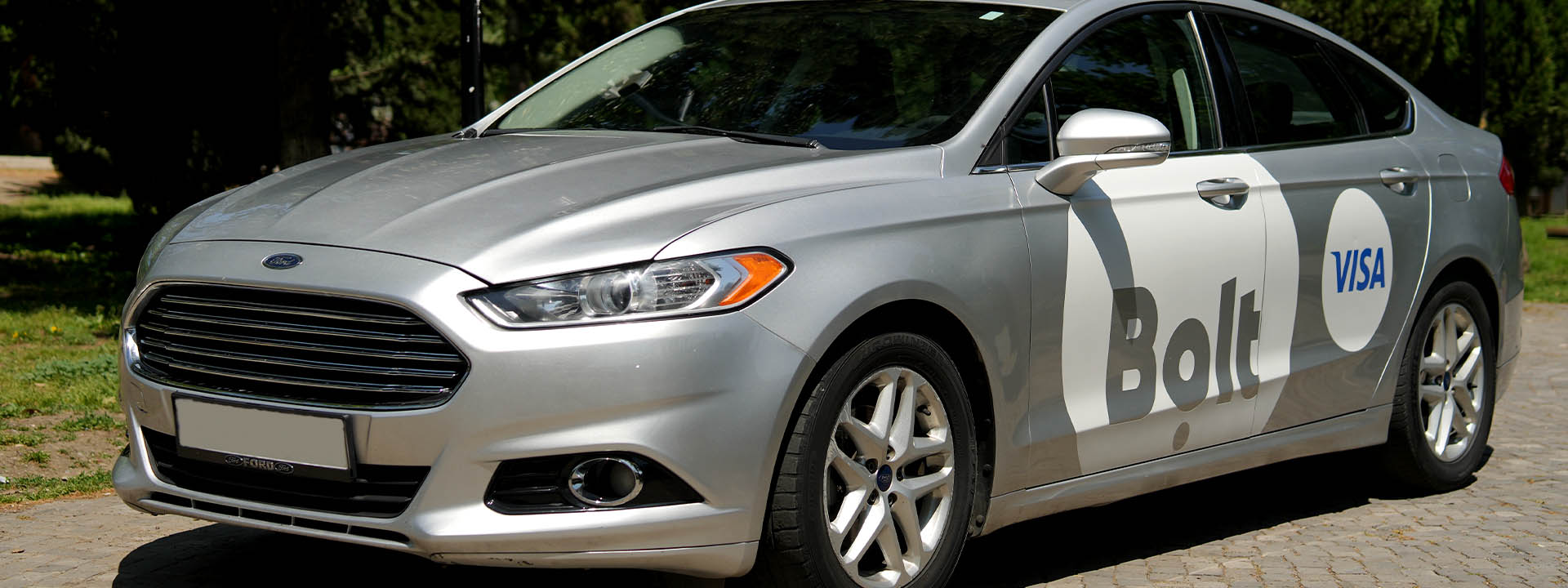 A silver car parked on the side of the road